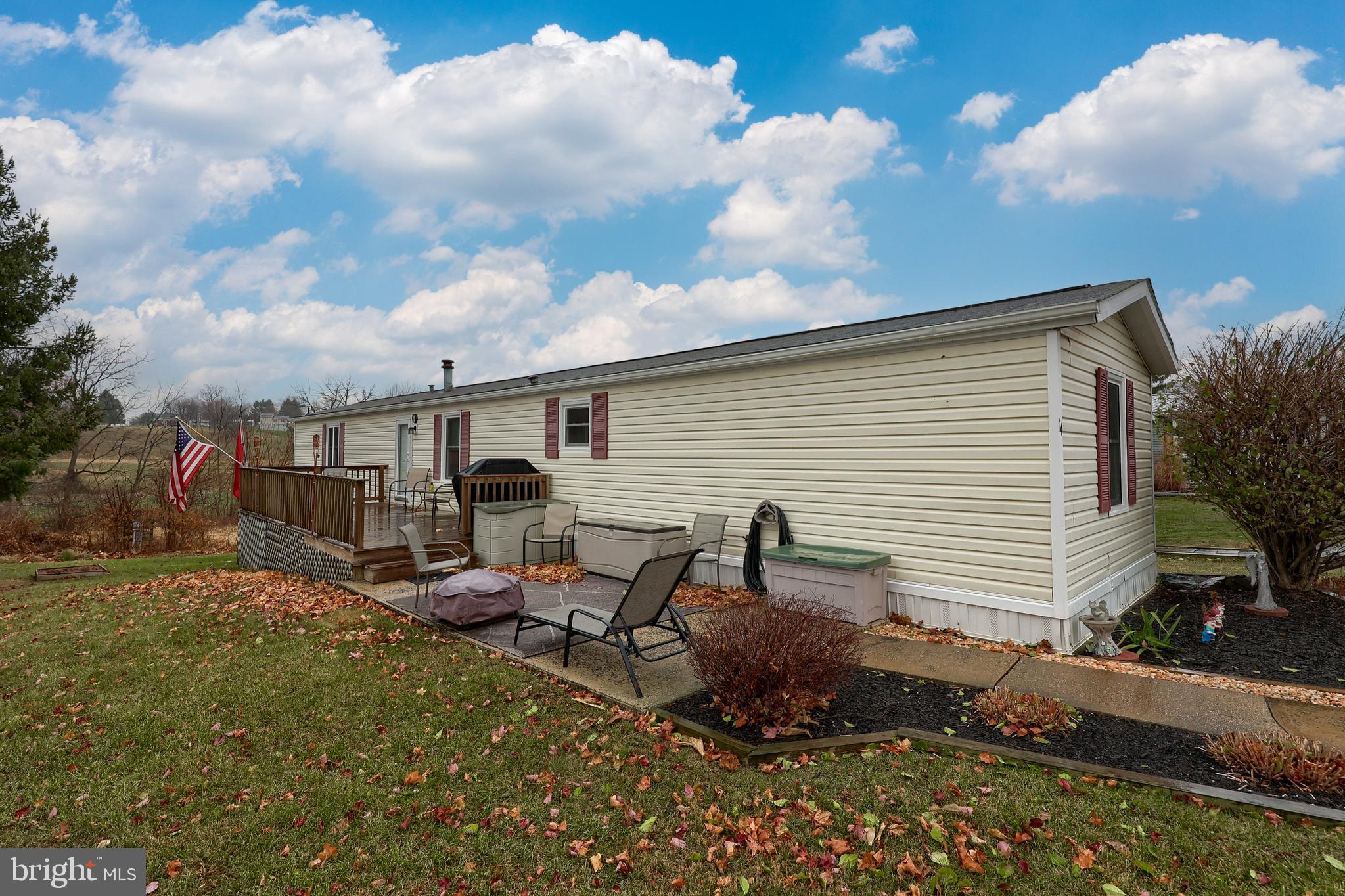 a view of backyard with sitting area