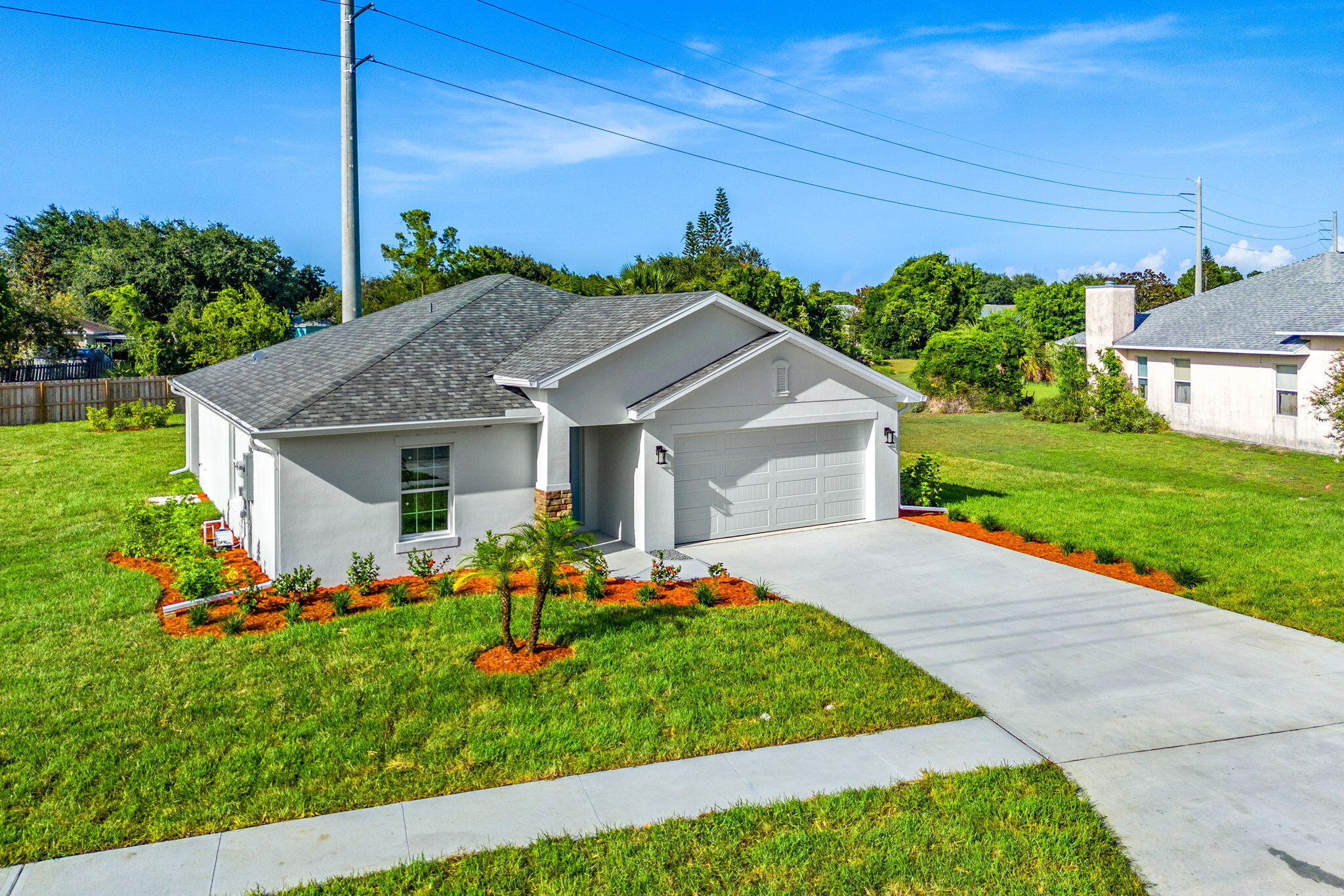 a front view of house with garden