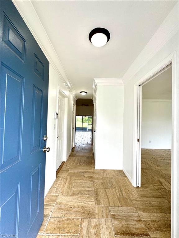 a view of a room with wooden floor and staircase