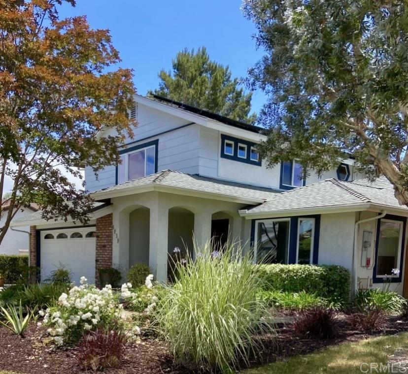 front view of a house with a garden