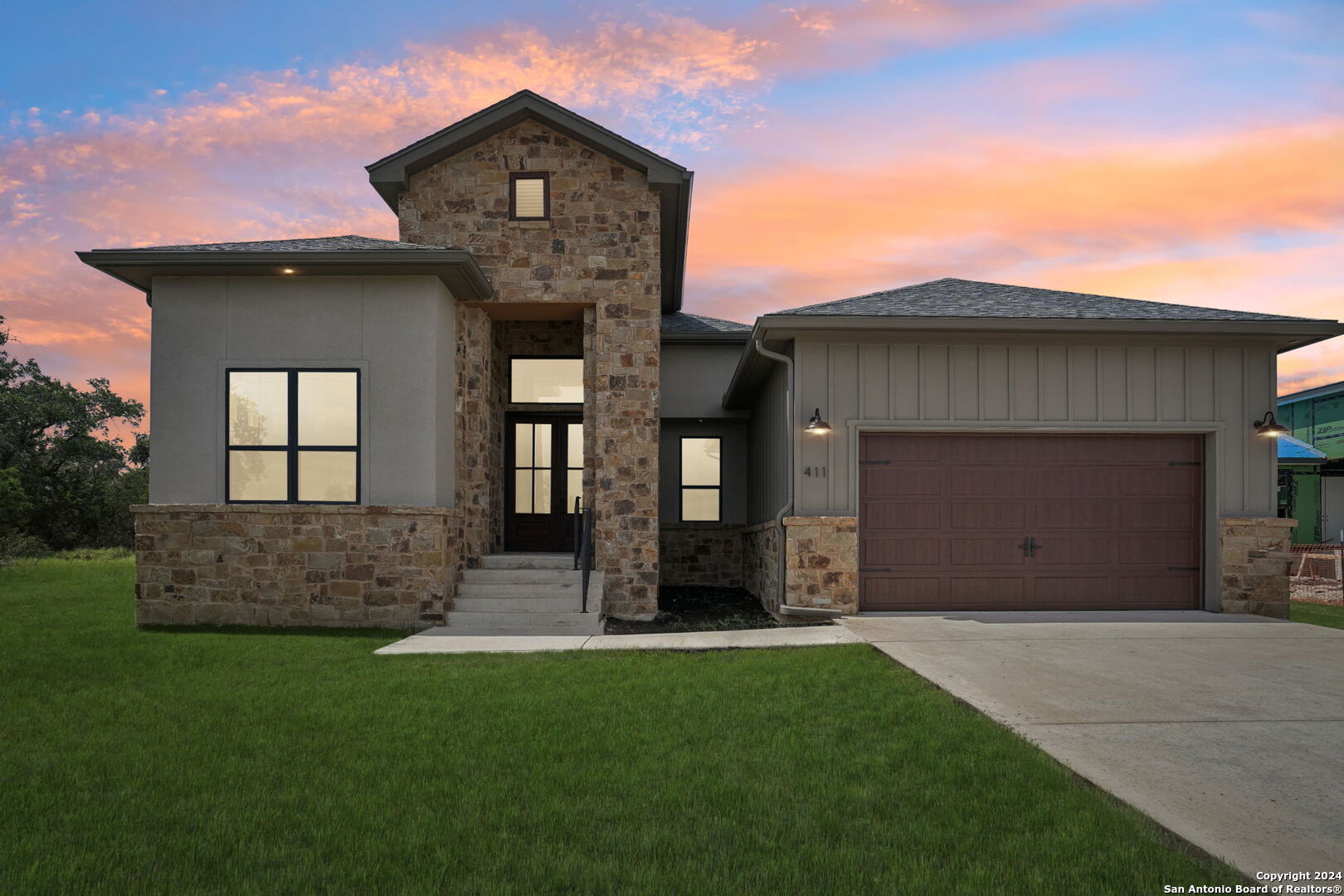 a front view of a house with a yard