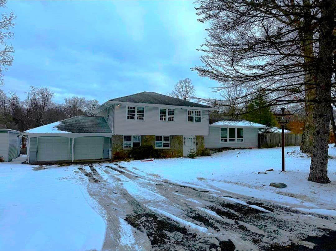 View of front of home featuring a garage