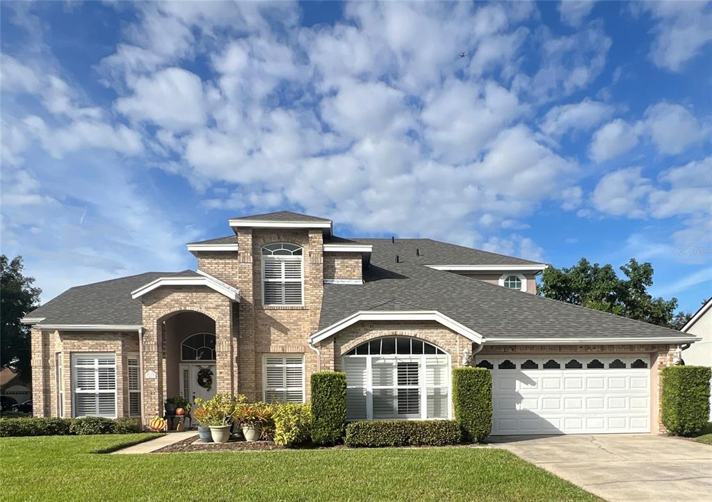 a front view of a house with yard