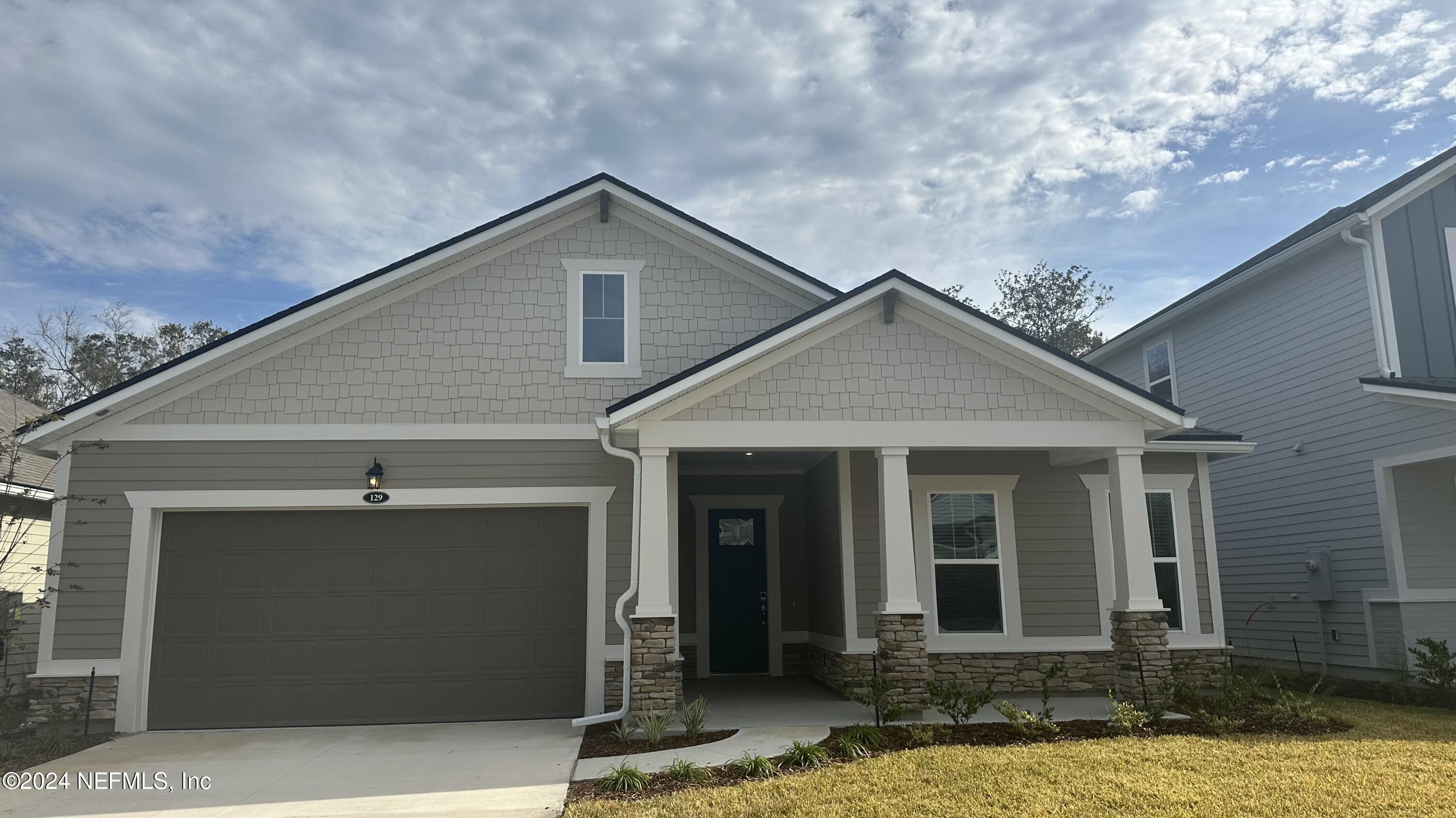 a front view of a house with yard