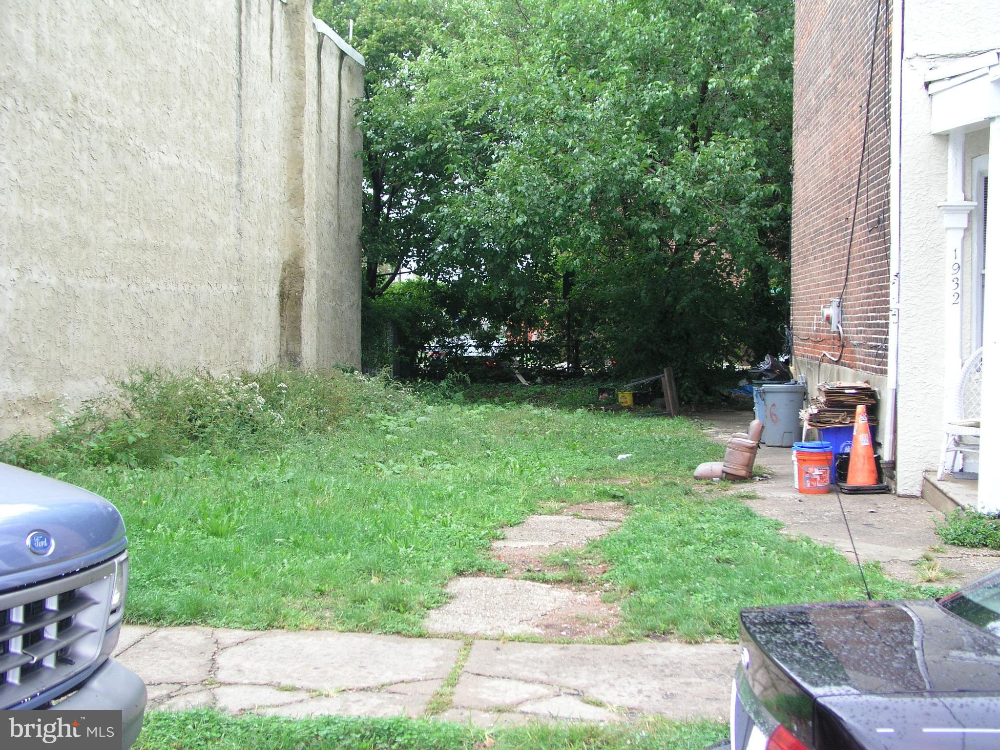 a view of a backyard with sitting area and slide