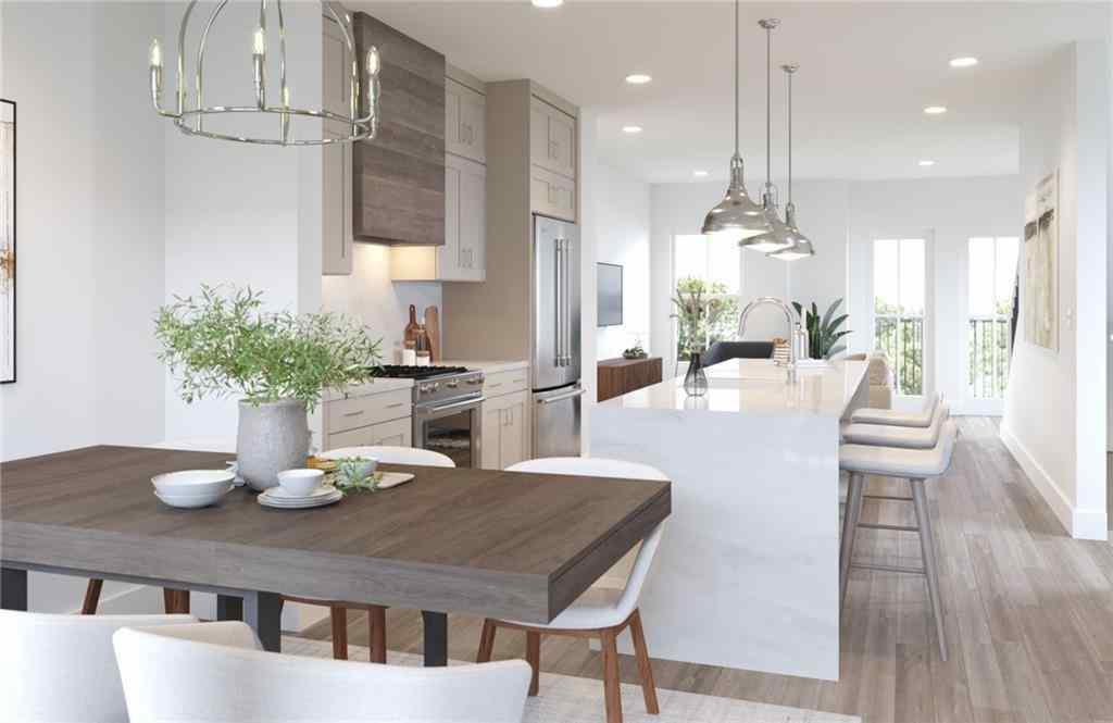 a kitchen with a table and chairs