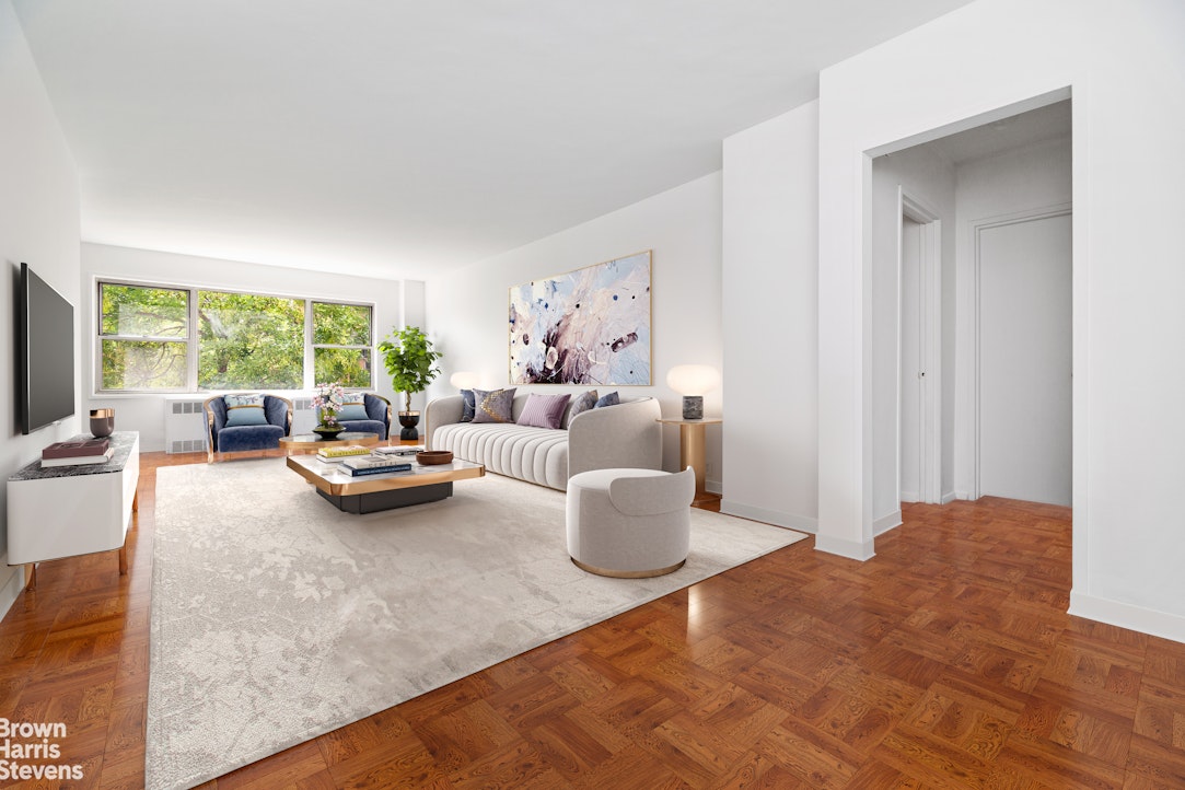 a living room with furniture and a large window