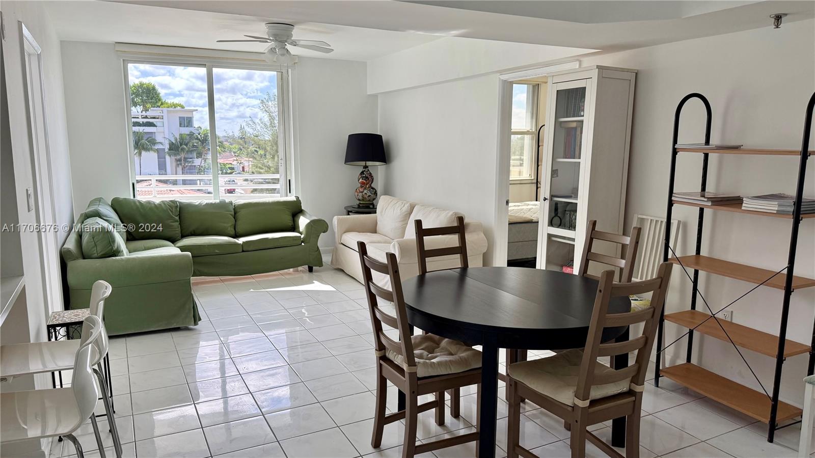 a dining room with furniture window and outside view