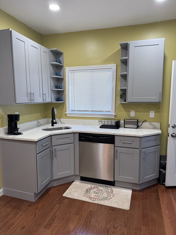 a kitchen with granite countertop white cabinets and white appliances