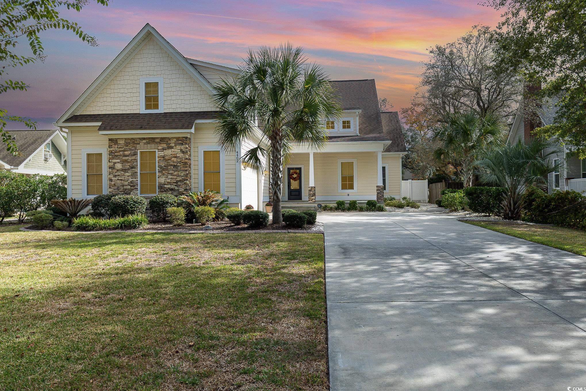 View of front facade with a lawn