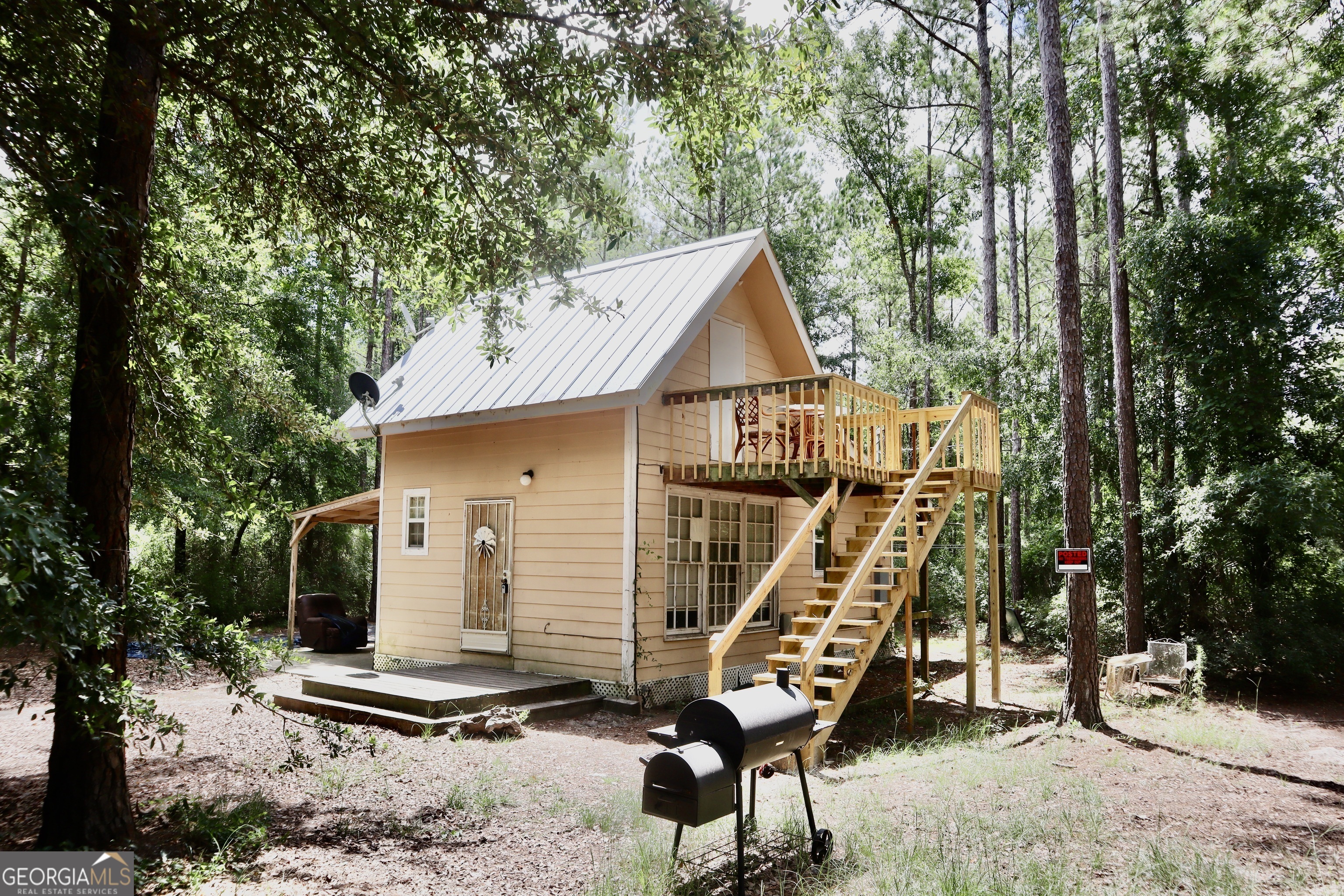 a view of a house with a park bench