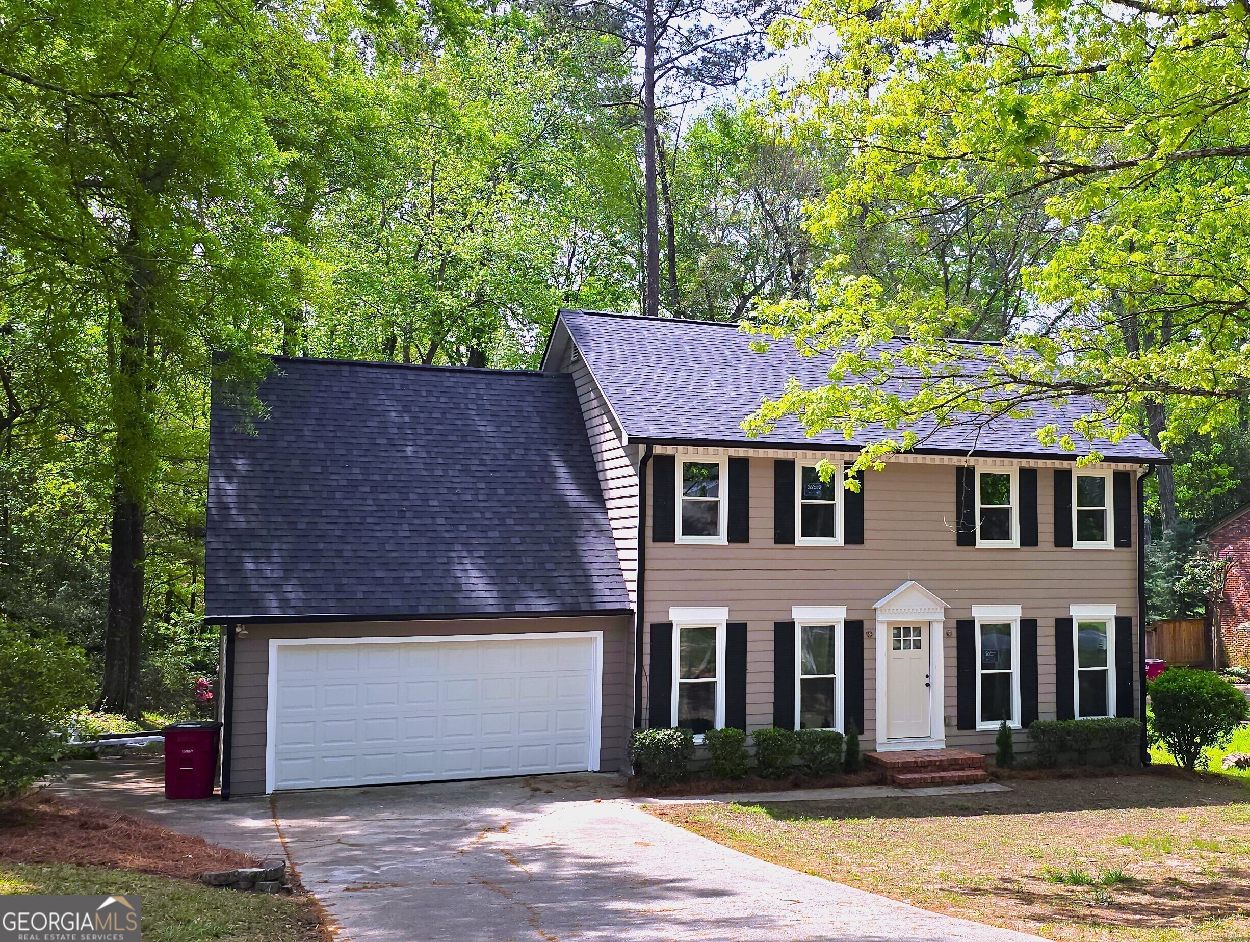 front view of a house with a yard