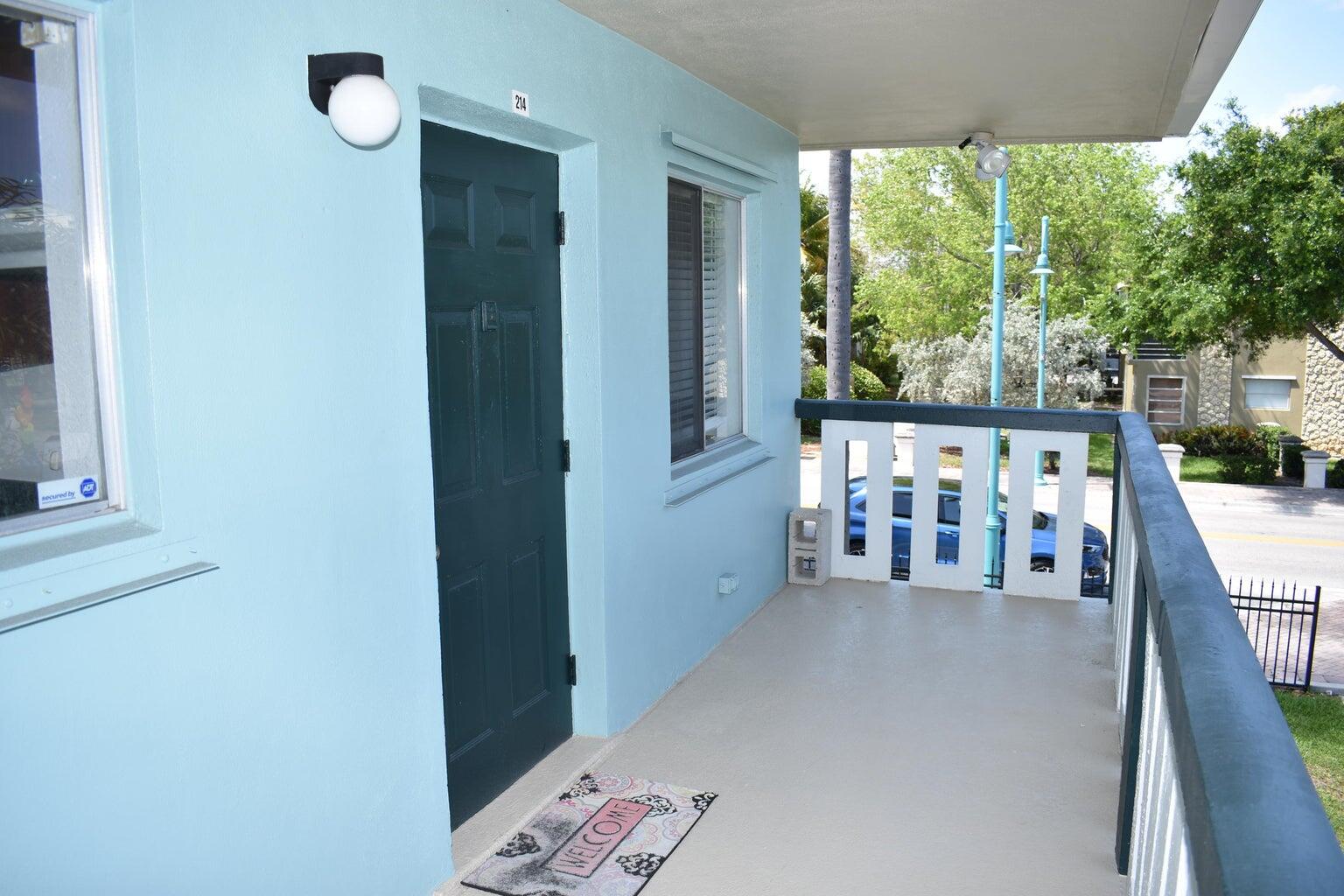 a view of a balcony with chairs