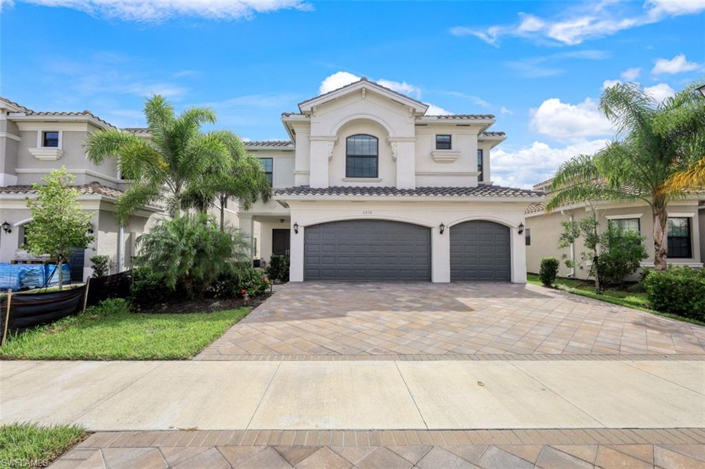 a front view of a house with a garage