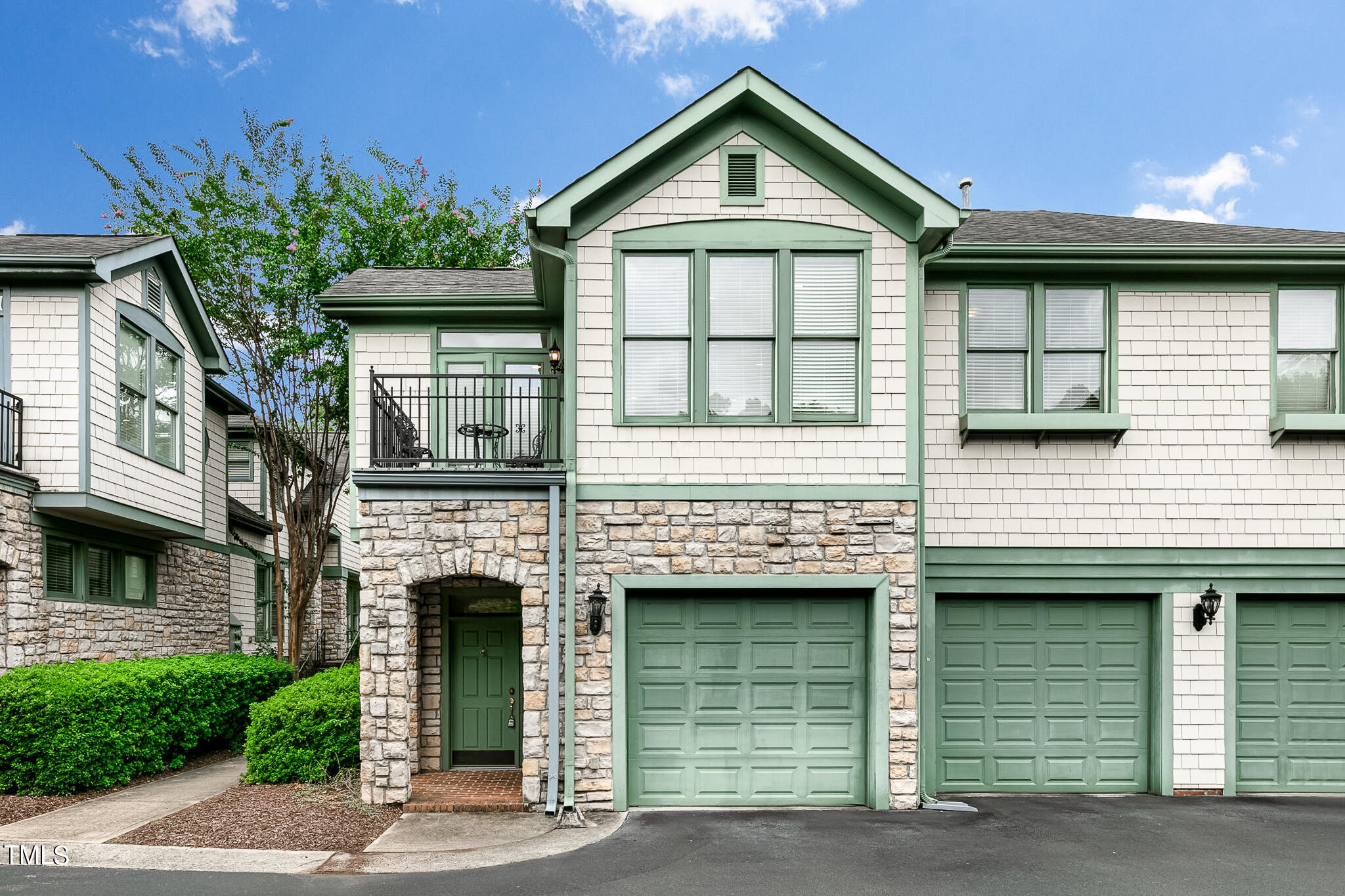 a front view of a house with a garage