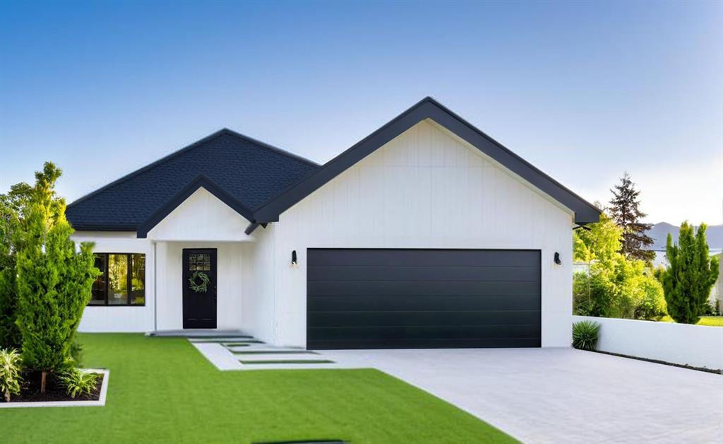 a front view of house with yard and garage