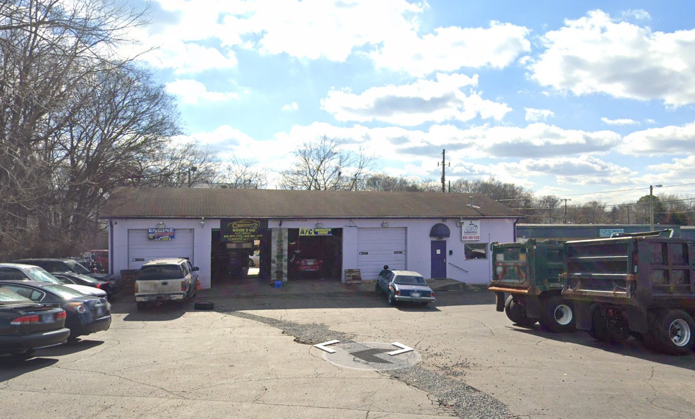 a view of a car park in front of garage