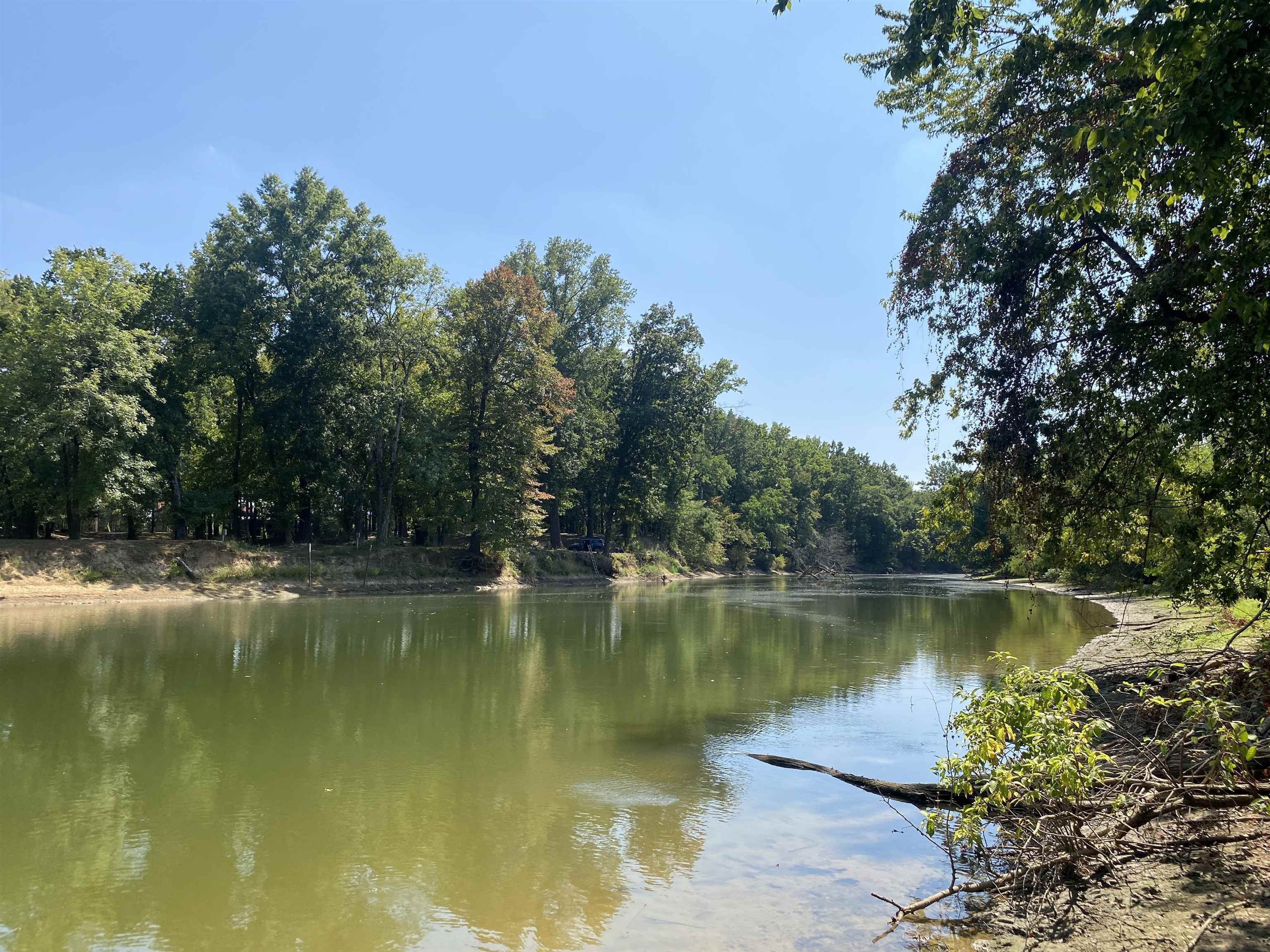 a view of a lake with a yard