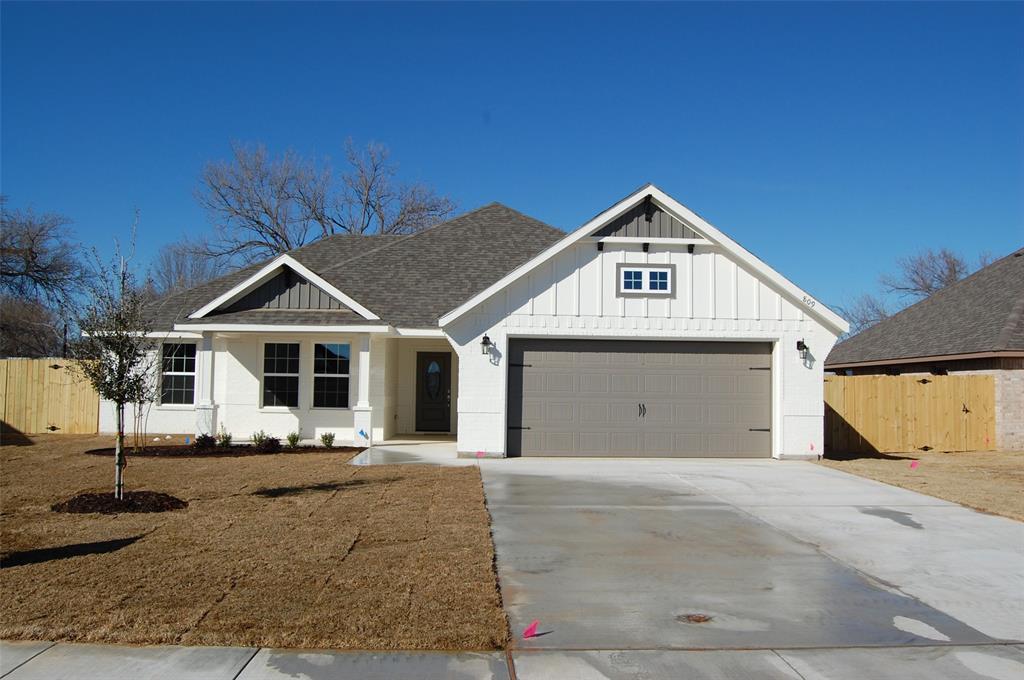 a front view of a house with yard