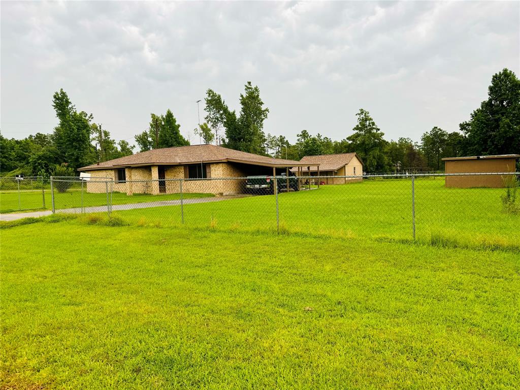 a view of a house with a big yard