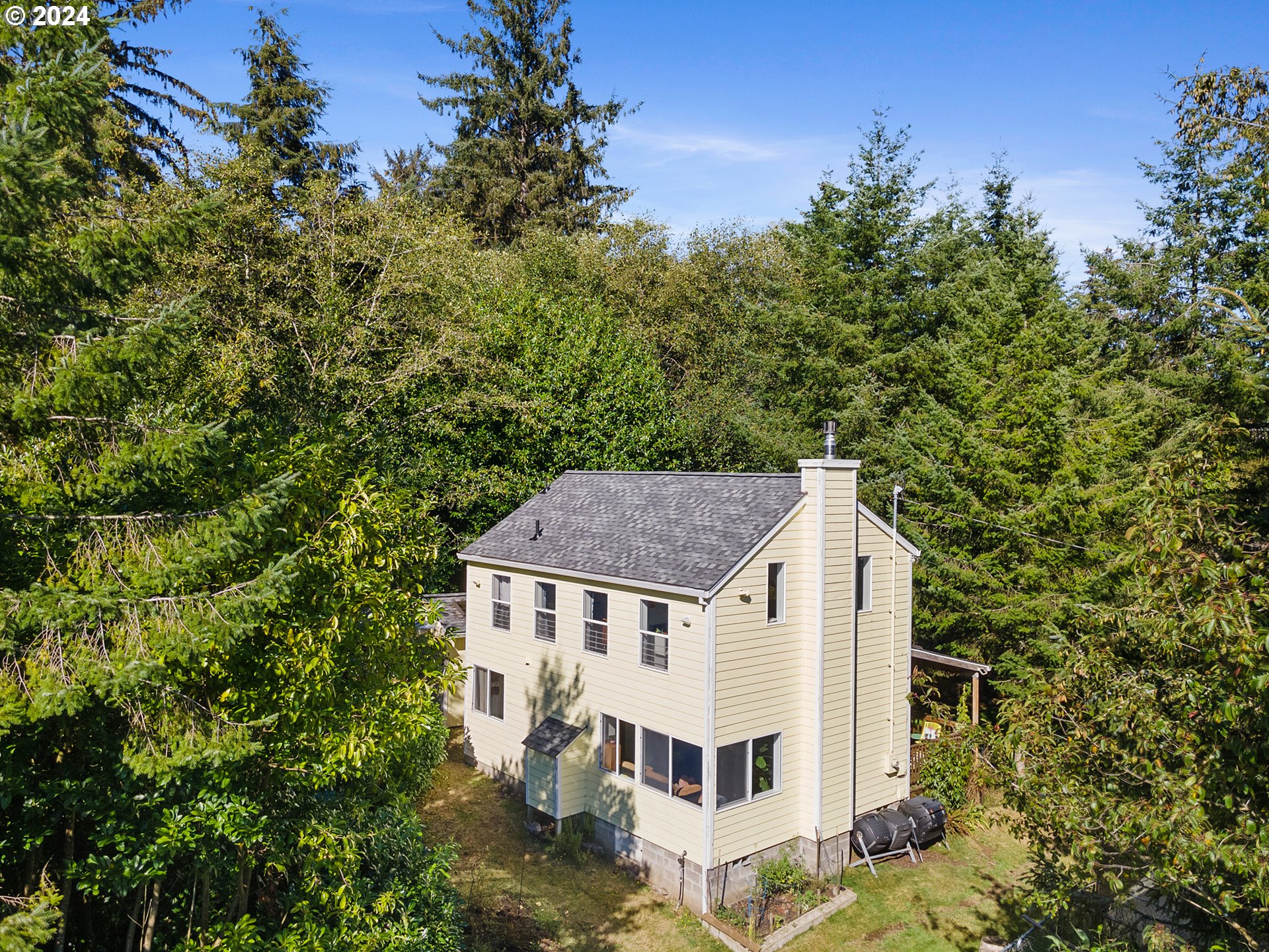 aerial view of a house with a yard