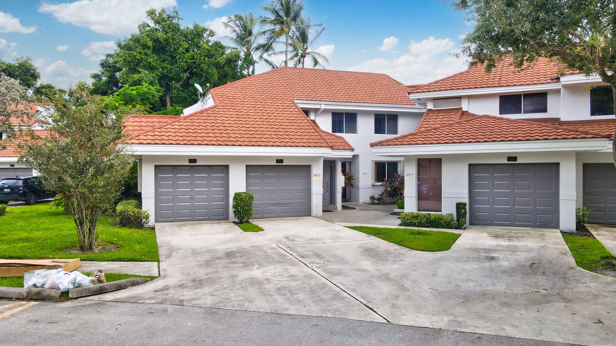 a front view of a house with garden