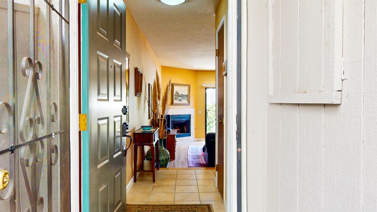 a view of a hallway with a dining area