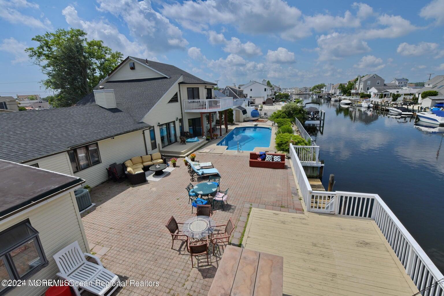 an aerial view of a house with outdoor space