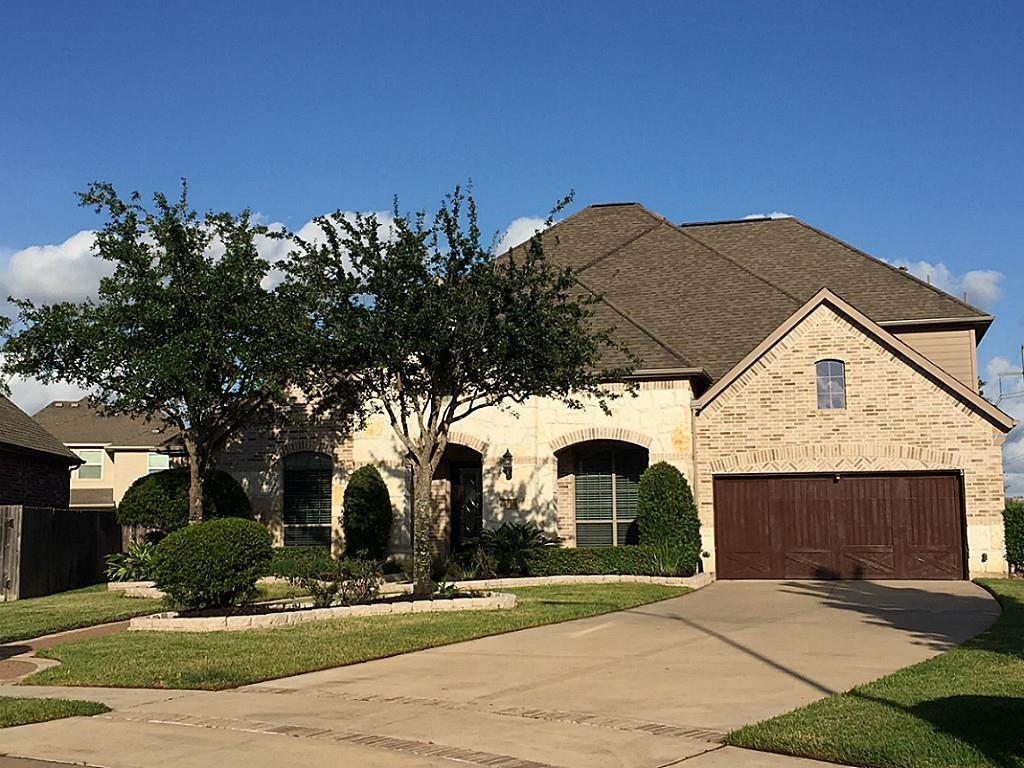 a front view of a house with yard