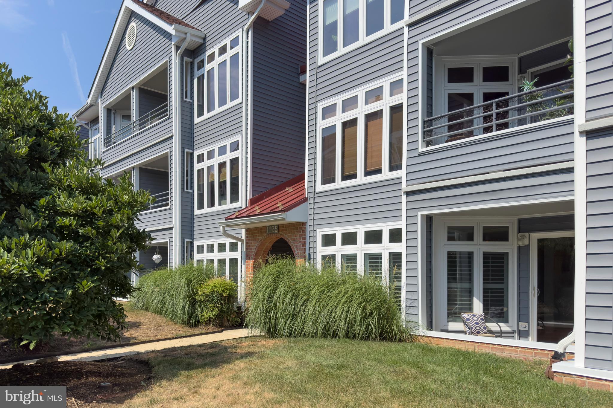 a view of a building next to a yard