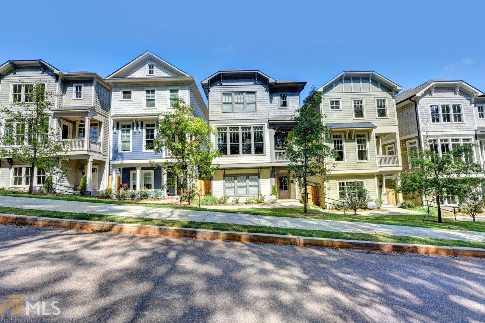 front view of residential houses with a yard