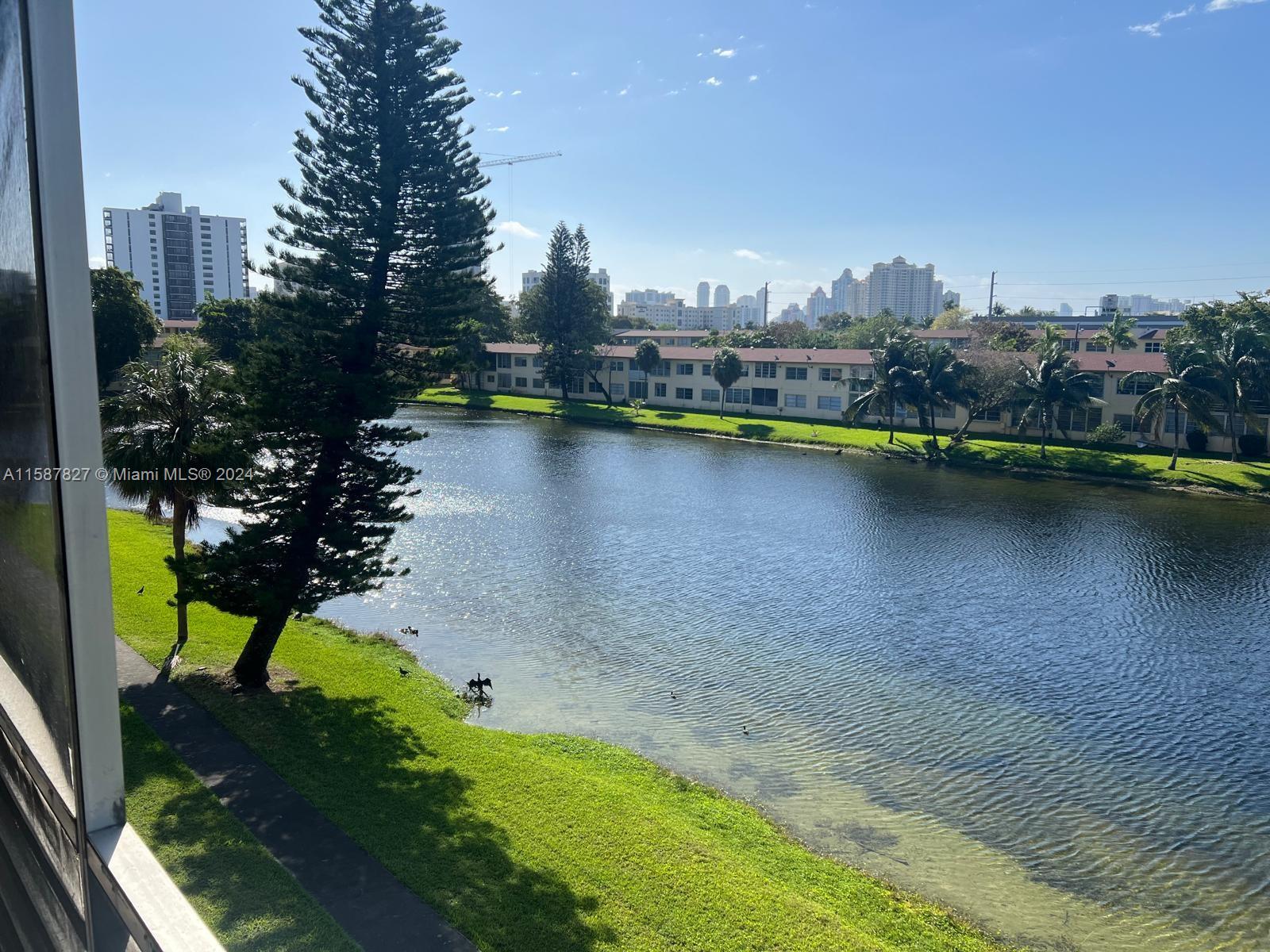 a view of a lake with a city