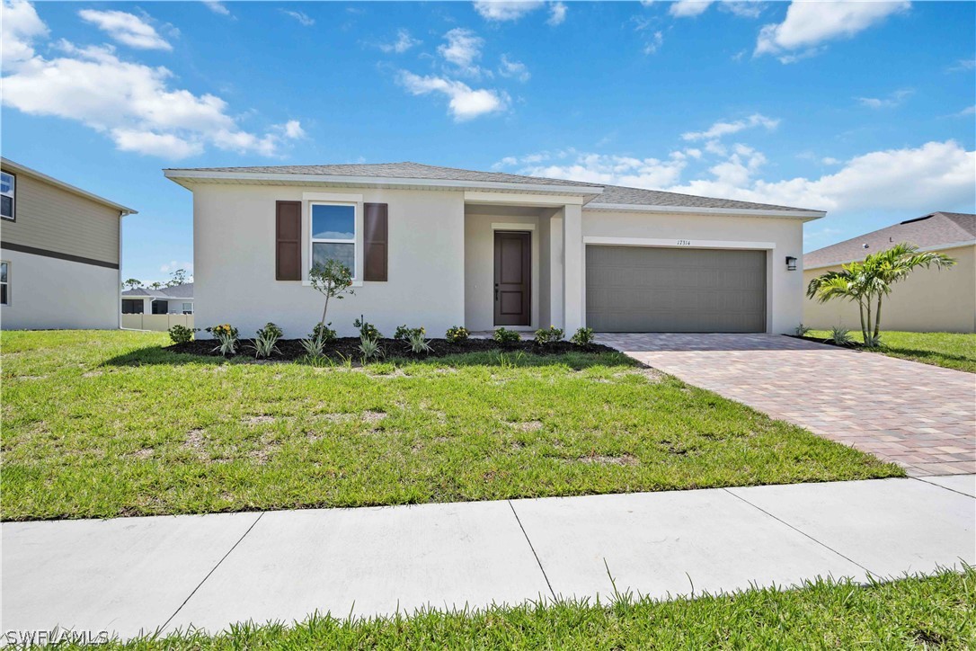 front view of a house with a yard