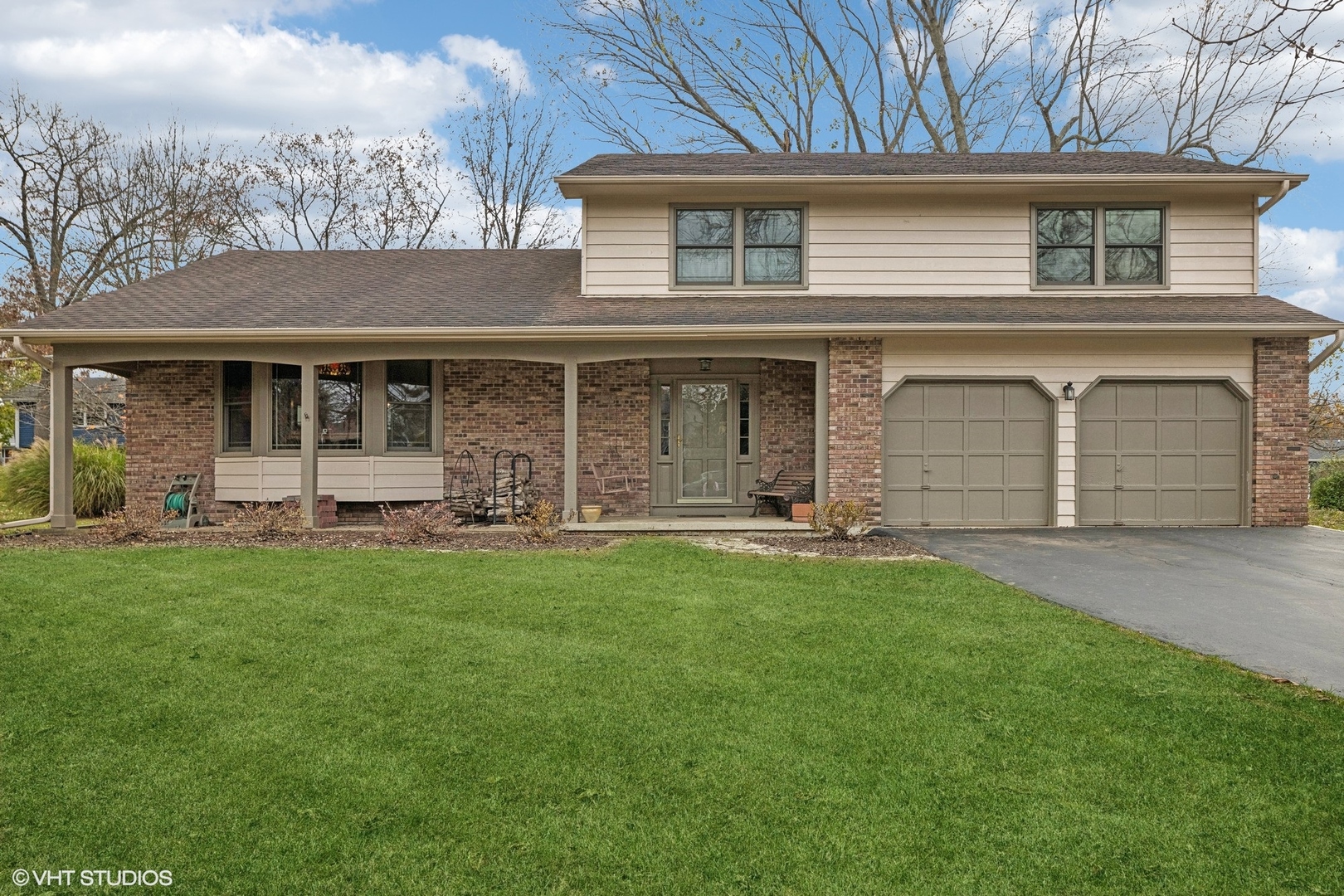 front view of a house with a yard