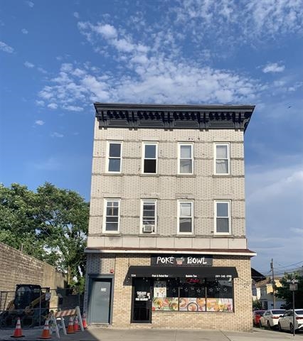 a front view of a building with street view