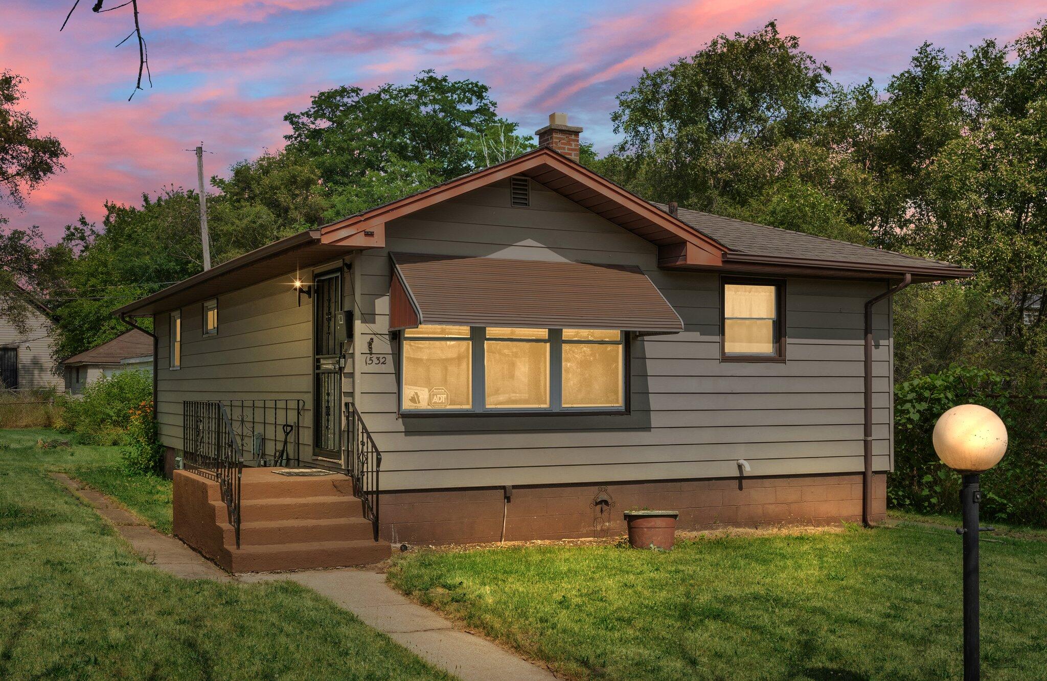 a front view of a house with a yard