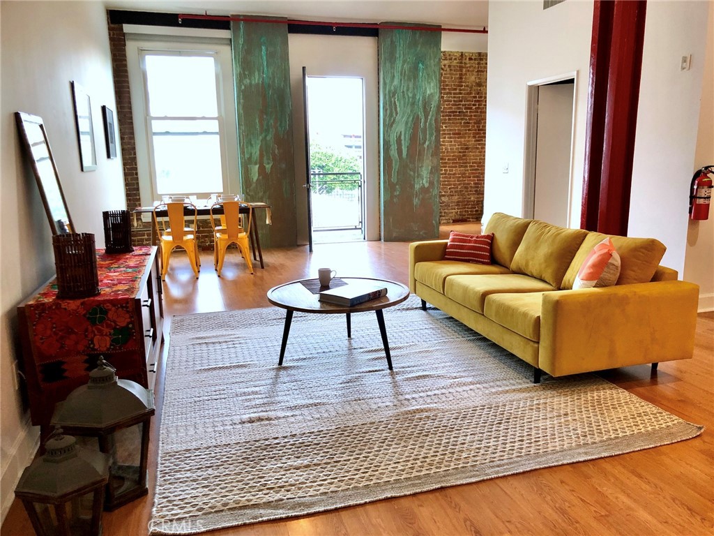 a living room with furniture and a rug