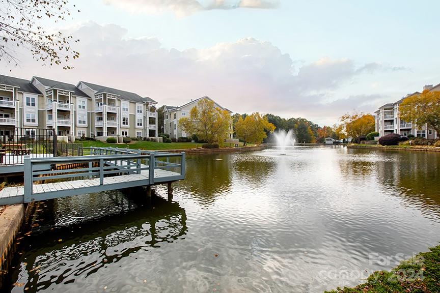 a view of a lake with a building in front of it