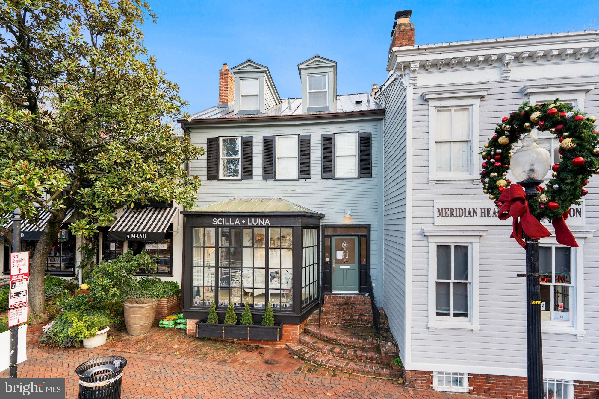 a front view of a house with a porch