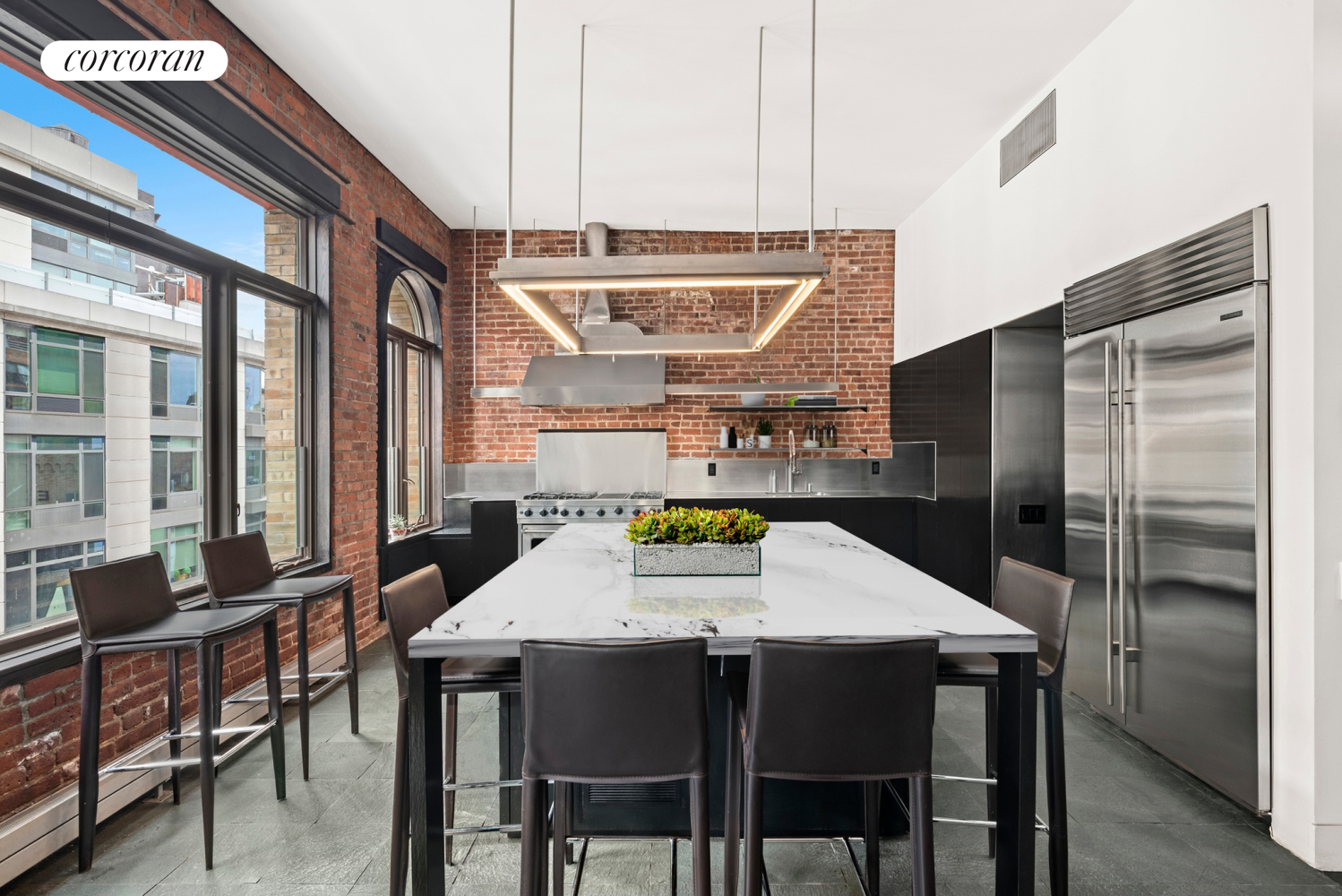 a kitchen with a table and chairs in it