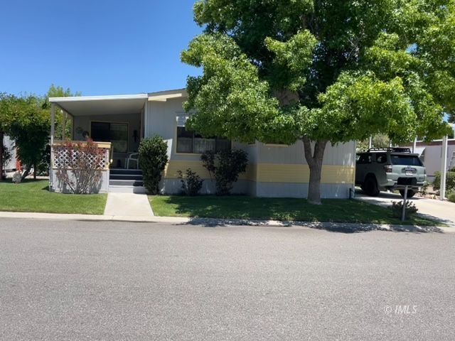 a view of a house with a yard and garage