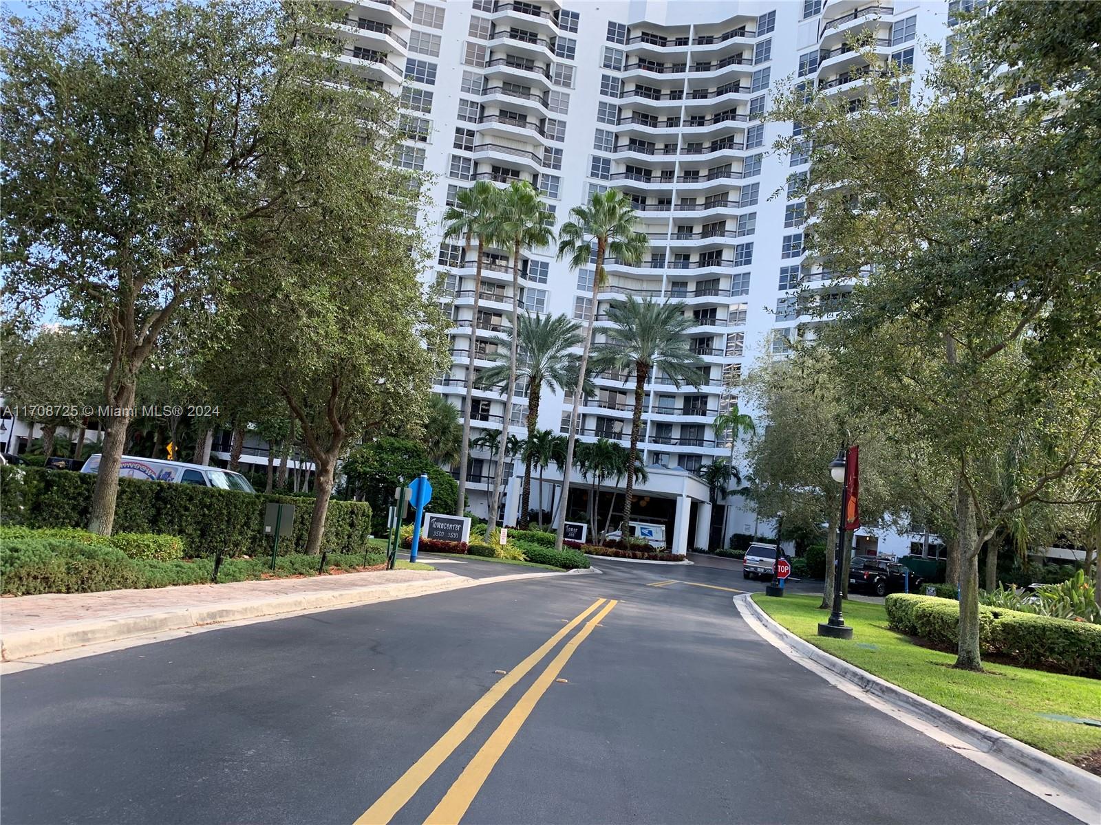 a view of tall buildings and a street