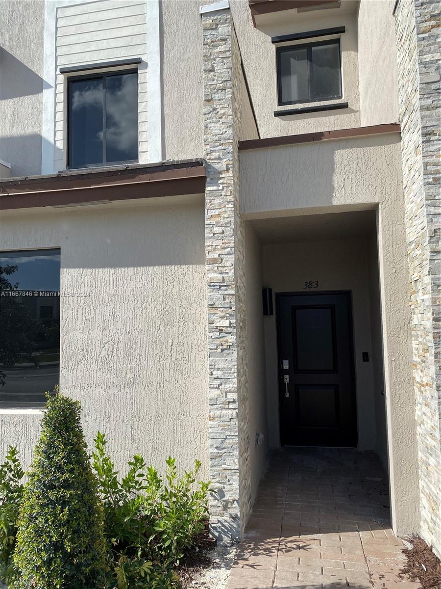 a house with a door and balcony