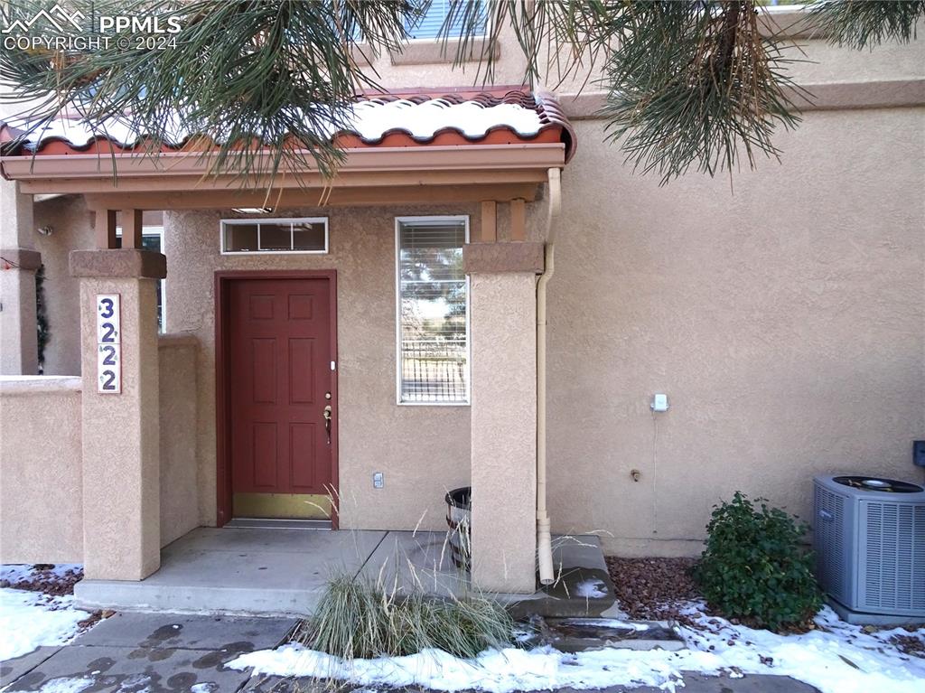 Property entrance with central air condition unit