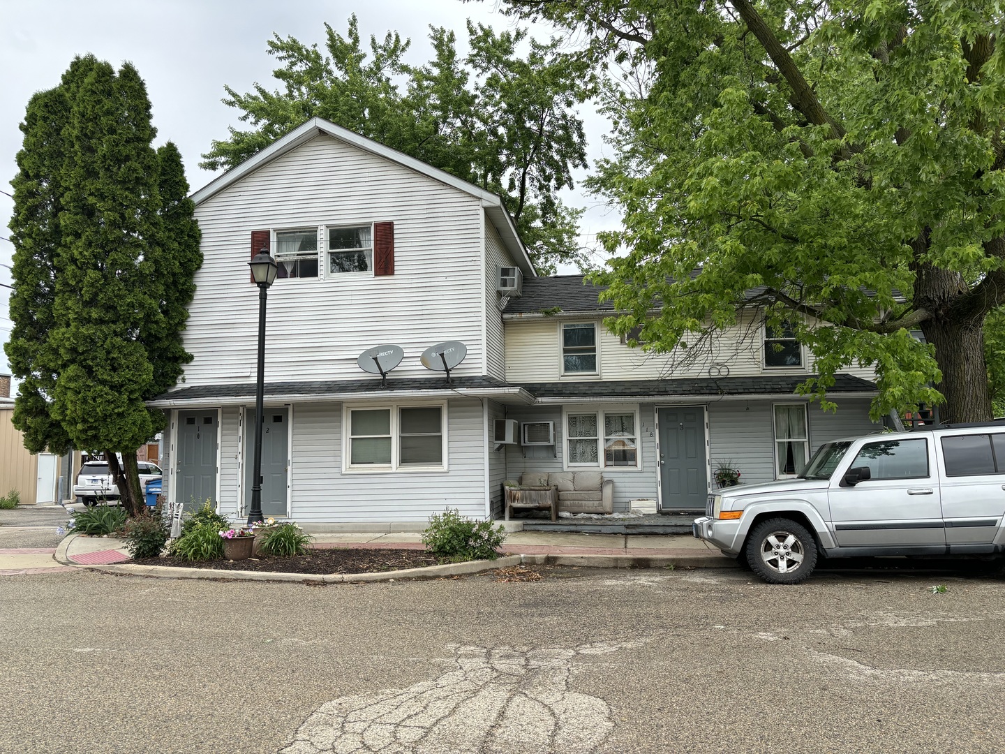 a view of a car parked in front of a house