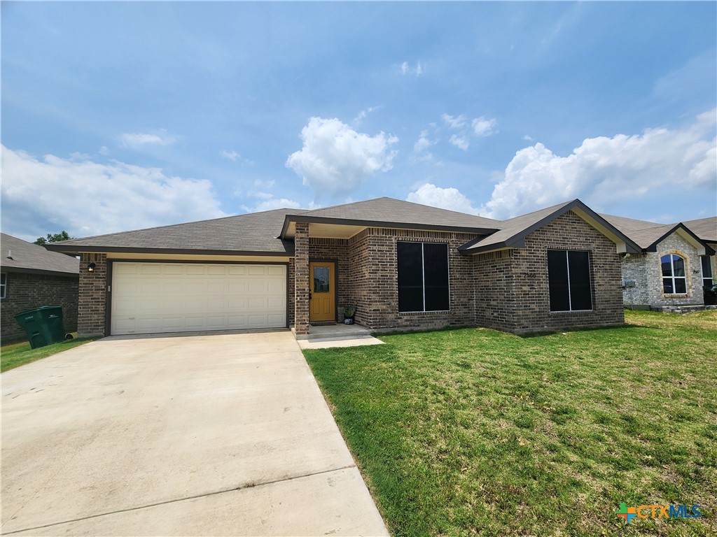 a front view of a house with yard