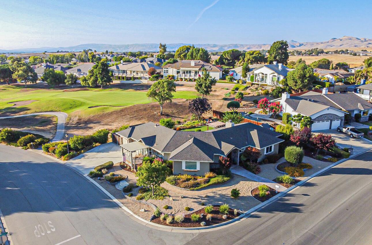 an aerial view of a house with a ocean view