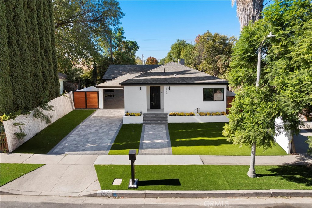 a front view of a house with garage