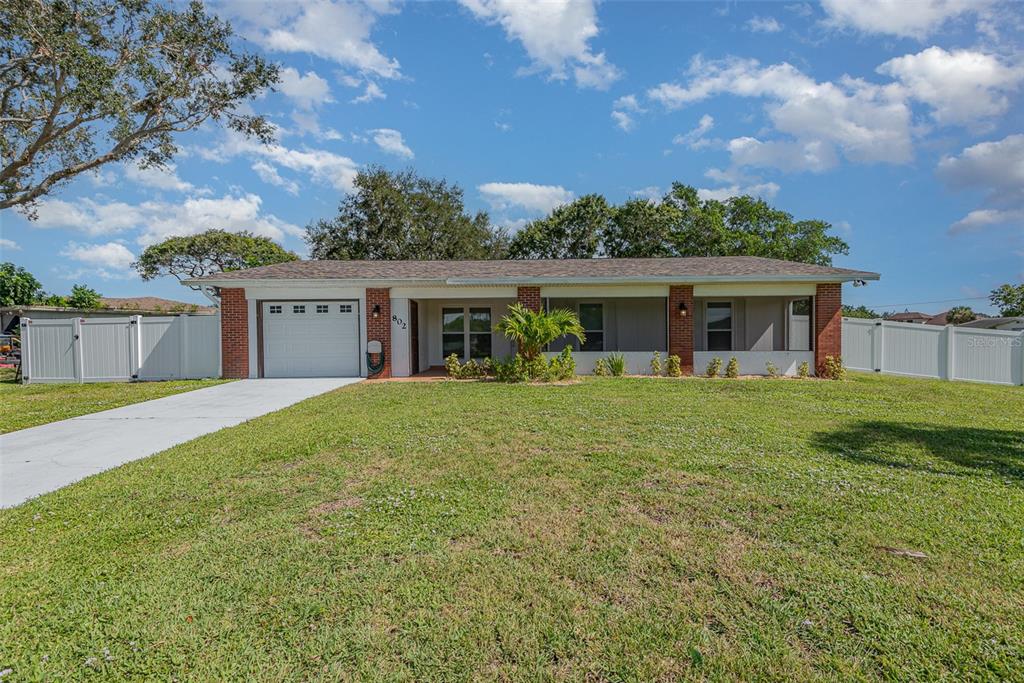 front view of a house with a yard