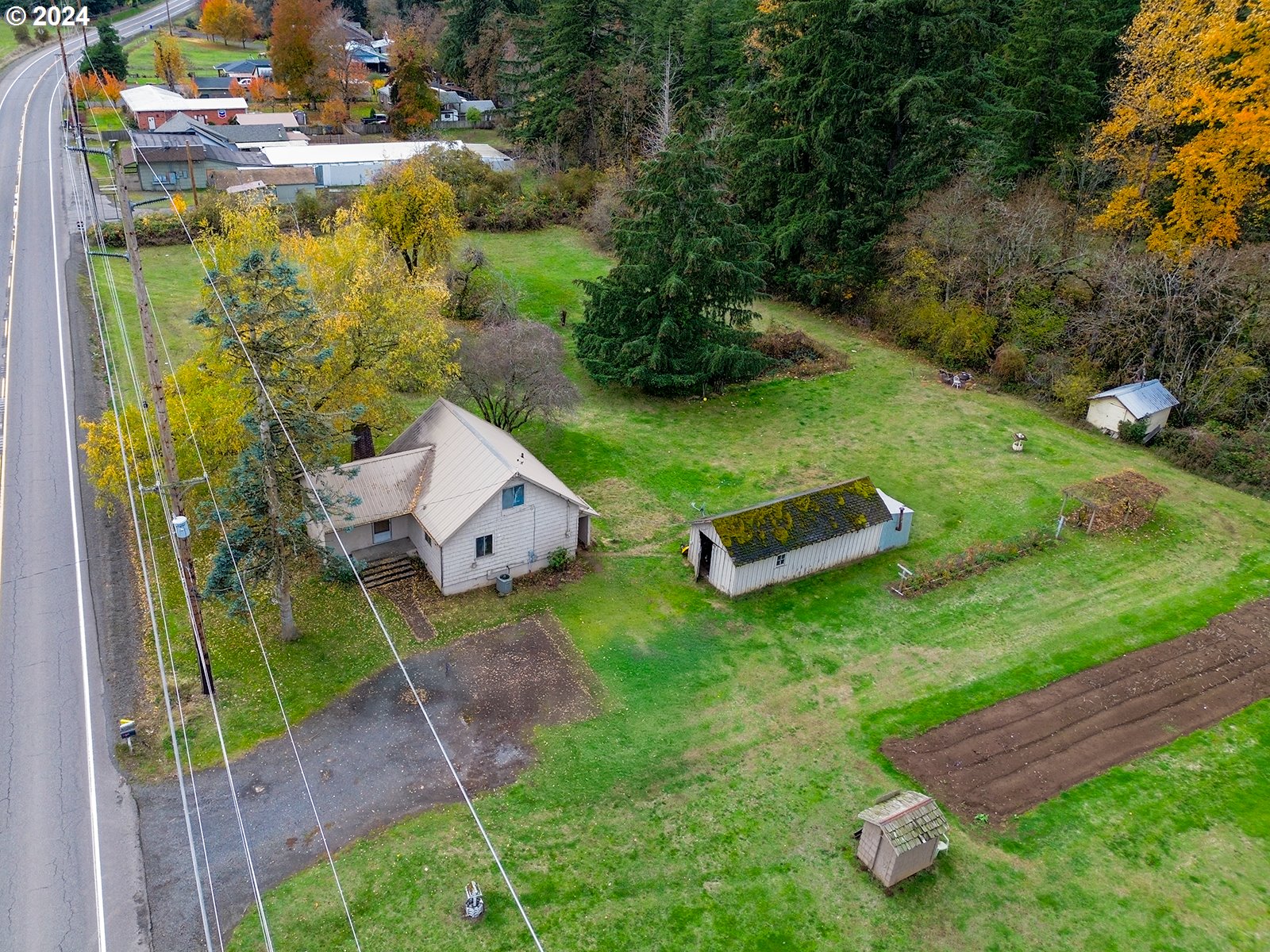 an aerial view of a house with pool